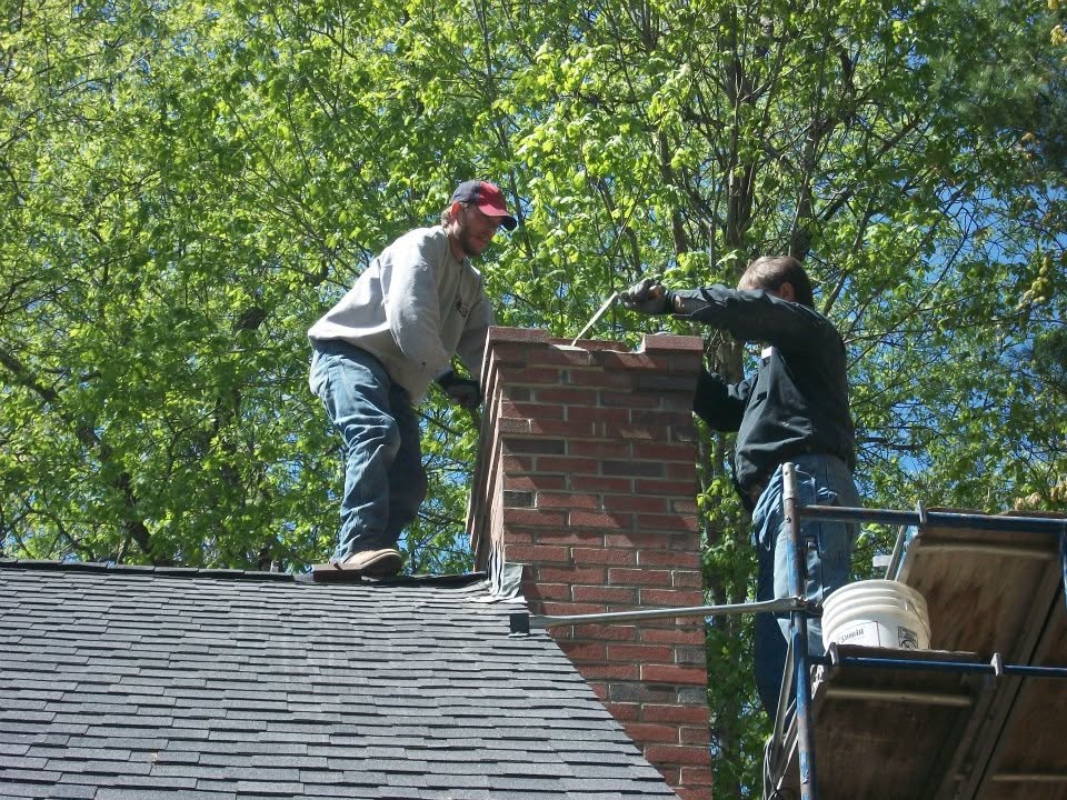 Fireside Sweeps team performing chimney work