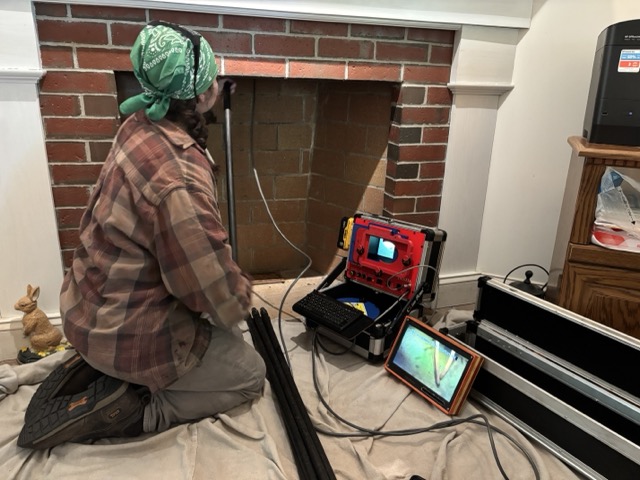 Certified Chimney Sweep doing camera chimney inspection in Newton, NH Fireplace