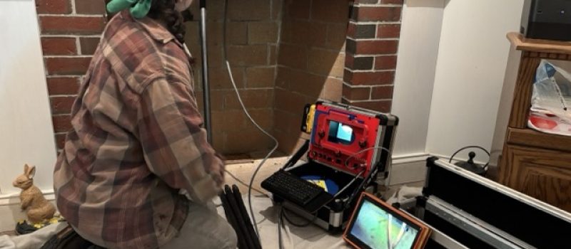 Certified Chimney Sweep doing camera chimney inspection in Newton, NH Fireplace